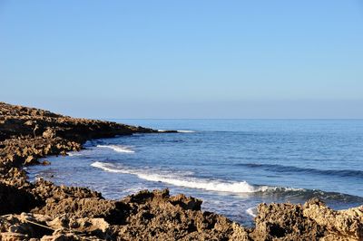 Scenic view of sea against clear sky