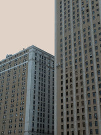 Low angle view of modern buildings against sky