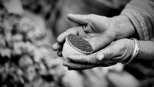 Close-up of hand holding sand