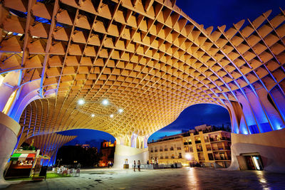 Low angle view of illuminated buildings at night