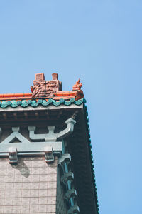 Low angle view of traditional building against clear blue sky