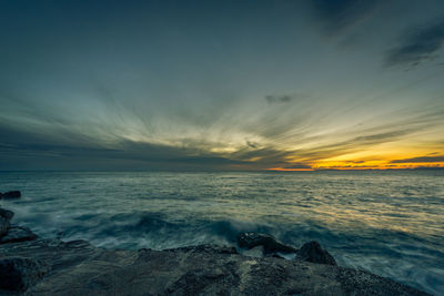 Scenic view of sea against sky during sunset