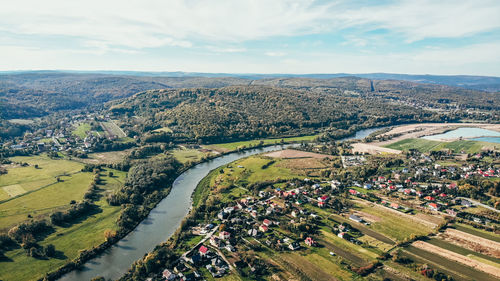 High angle view of city buildings against sky