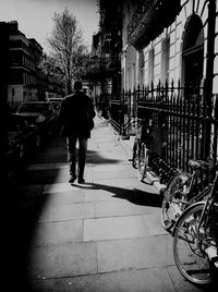 Rear view of woman standing in city