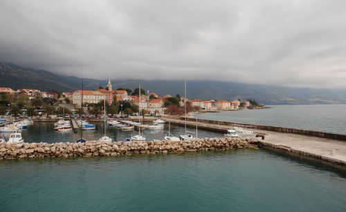 Town against cloudy sky