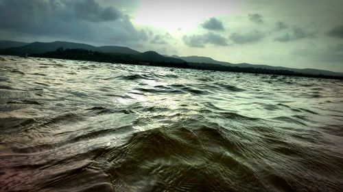 Scenic view of sea against dramatic sky