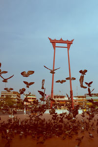 Low angle view of traditional windmill against sky