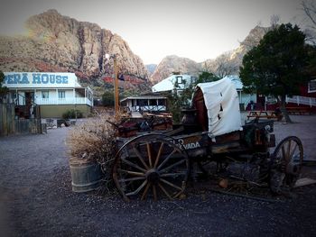 Cars on mountain against sky