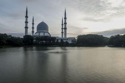 View of mosque against cloudy sky