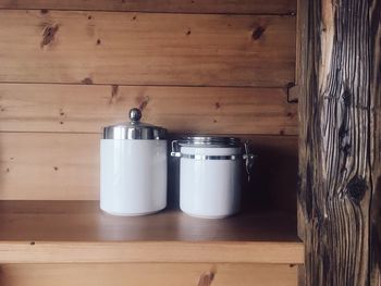 Candles on wooden wall at home