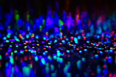 Neon rainbow glittering lights with glow effect abstract background