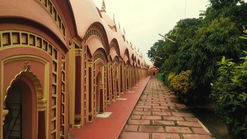 Narrow lane in old town against sky