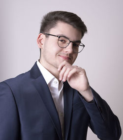 Portrait of young man against white background