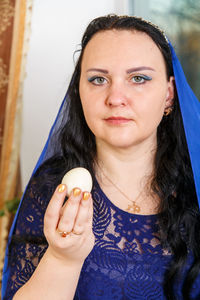 Portrait of woman holding ice cream