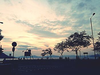 Street light against sky at sunset