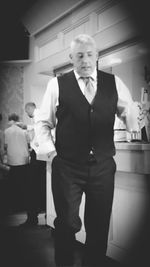 Portrait of friends standing at home