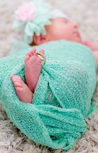 Newborn baby feet with rings