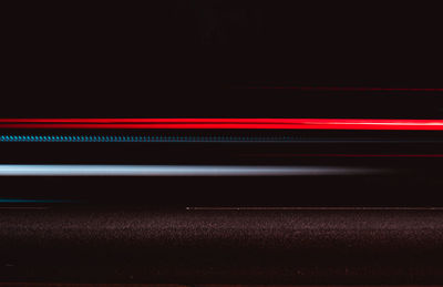 Close-up of illuminated road at night