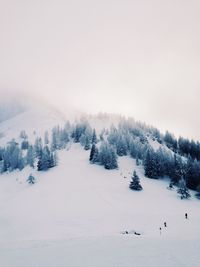 Scenic view of snow covered landscape against clear sky