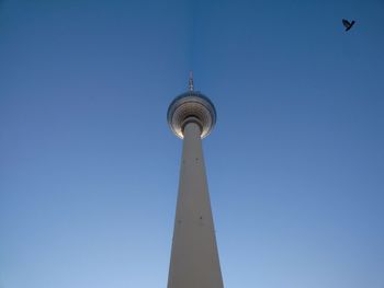 Low angle view of tower against blue sky