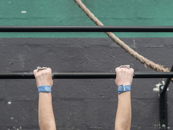 Low angle view of man holding rod