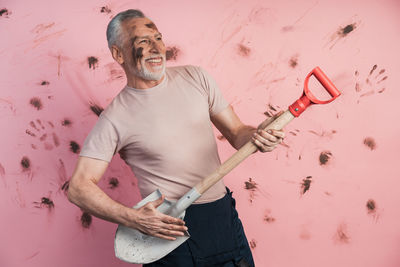 Full length of man standing against wall