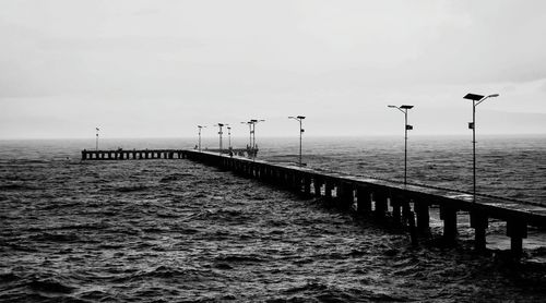 Pier on sea against sky