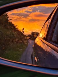 Reflection of sky on side-view mirror