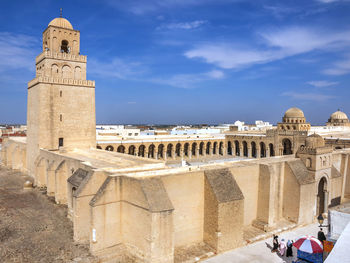 Group of people in front of historical building