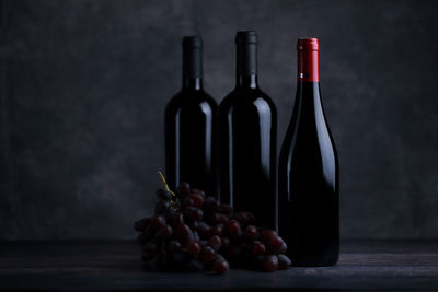 Grapes in glass container on table