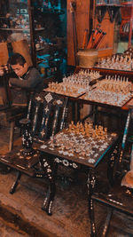 Side view of a young man preparing food