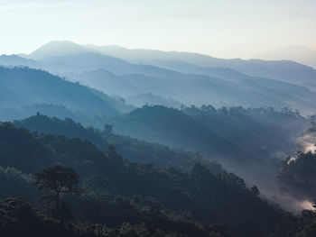 High angle view of trees and mountains against sky