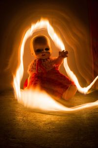 Young man smoking burning at night