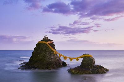 Long exposure shot of meoto-iwa rock and clouds in the morning, mie prefecture, japan