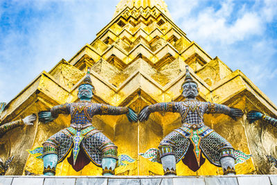 Low angle view of statue against sky