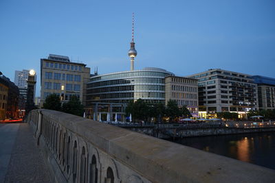 View of buildings in city at dusk