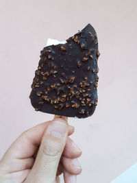 Close-up of hand holding ice cream cone