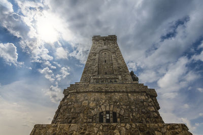 Low angle view of shipka monument against cloudy sky