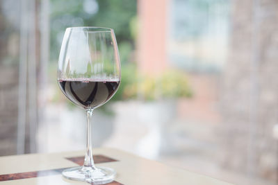 Close-up of wine glass on table