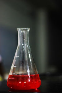 Close-up of glass bottle on table