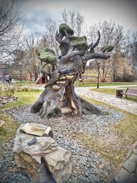 Sculpture of bare tree in park