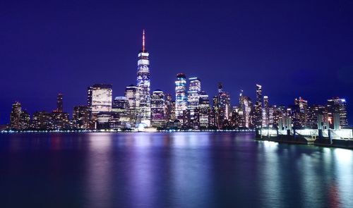 Illuminated buildings in city at night
