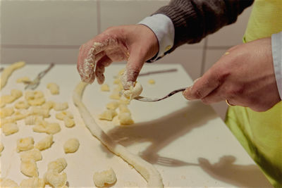 Midsection of person preparing food