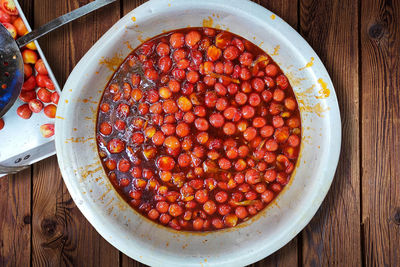 Picture of ramadan special tomato chutney in a large aluminum container 