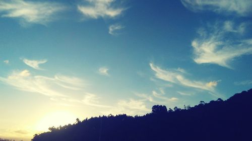 Silhouette trees against sky during sunset