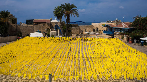 Scenic view of village against cloudy sky