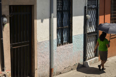 Woman standing in front of building