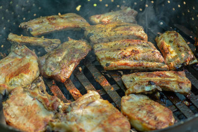 High angle view of meat on barbecue