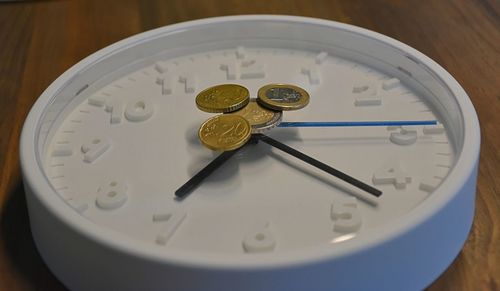 High angle view of clock on table