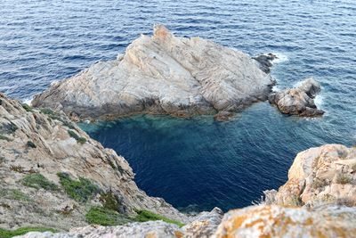 High angle view of rock formation in sea